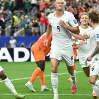 Erling Haaland is mobbed by his teammates