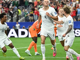 Erling Haaland is mobbed by his teammates