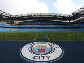 Manchester City badge at the club's Etihad Stadium