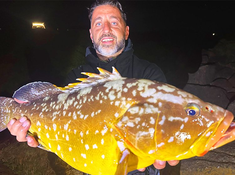 Eugene Grobler with a massive yellowbelly rockcod caught off Splash Rock
