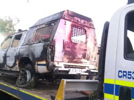 Group torches police vehicle over illegal booze