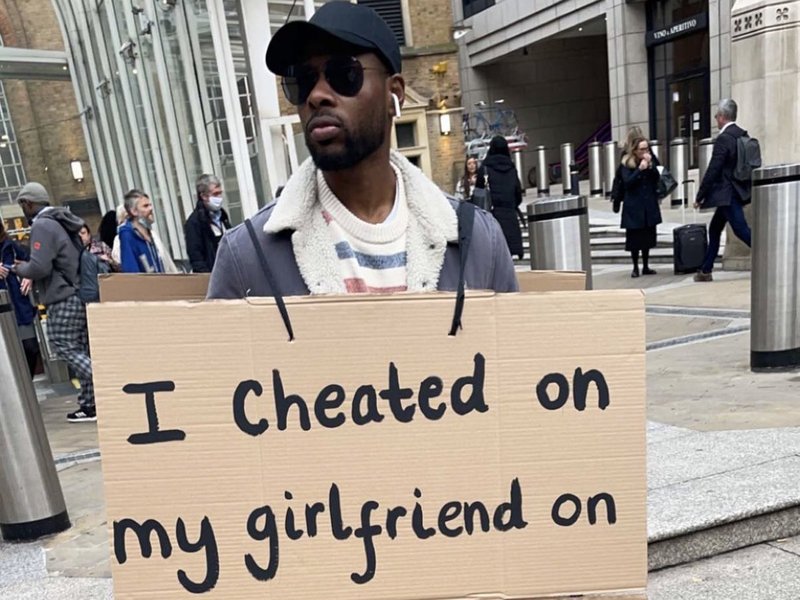 Community upset over men wearing "i cheated on my girlfriend signs"