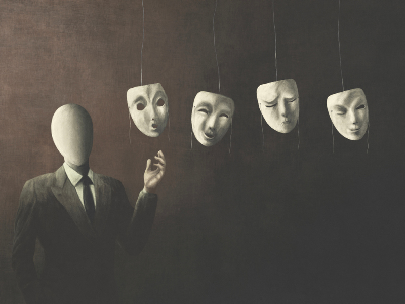 Faceless man in a suit choosing what mask to wear