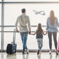 Family in airport watching flight about to take off