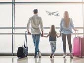 Family in airport watching flight about to take off