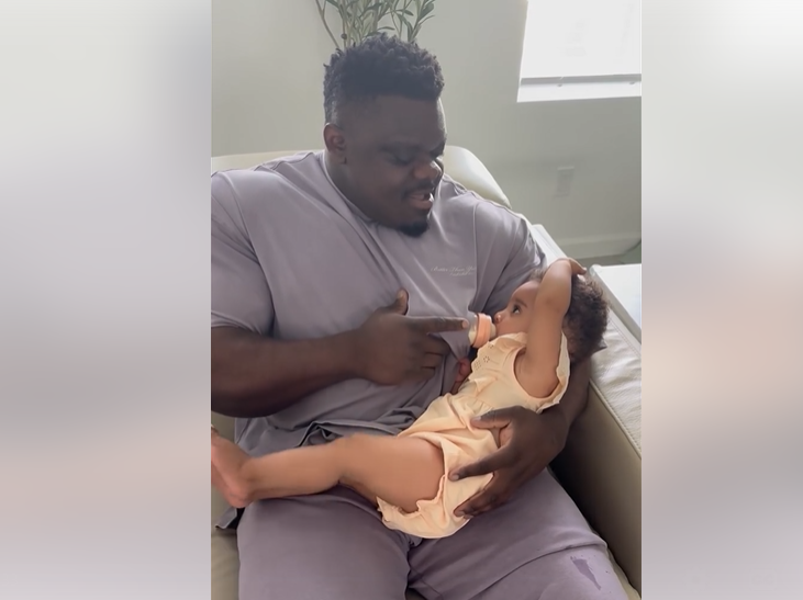 Father feeding baby