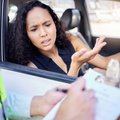 Young woman receiving fine