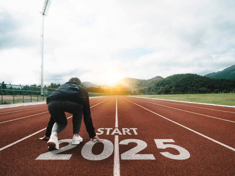 Female runner on an athletics track 2025