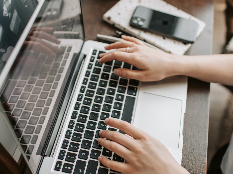 Female using a laptop in home office space