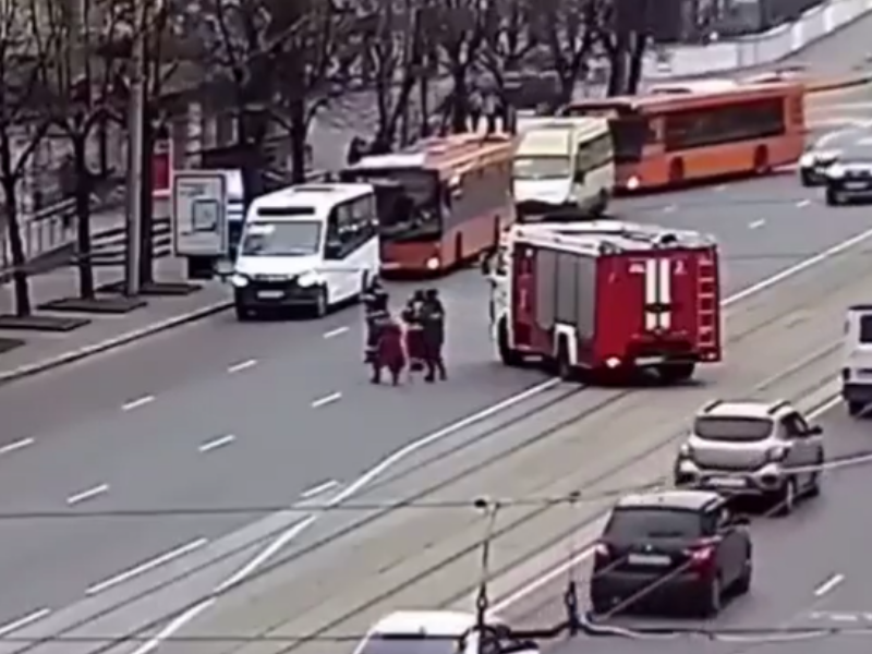 Firefighters stop traffic to help and old lady cross the road...