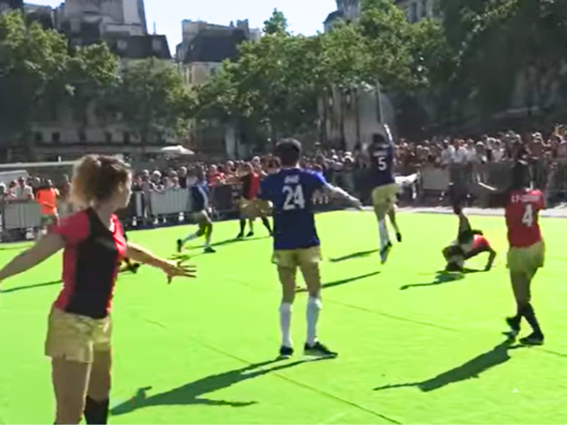 Football players dancing while playing football