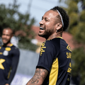 Footballer Neymar laughing during a practice session