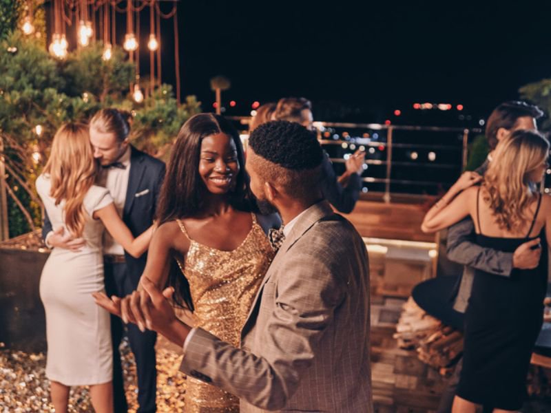Couples dressed formally dancing together