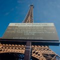 Eiffel Tower with a giant screen announcing its early closing due to heatwave in Paris