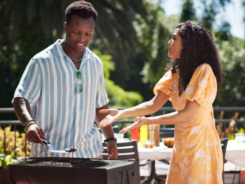 Friends having a braai together and chatting