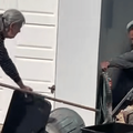 GARDENER CATCHING SNAKES