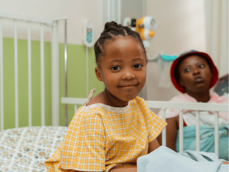 GIRL IN HOSPITAL BED SMILE FOUNDATION BURN VICTIM IMAGE