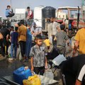 Gaza residents at water point