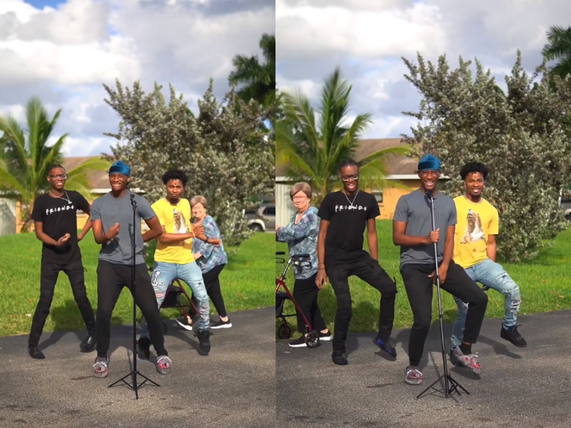 A grandmother dances with a group of boys