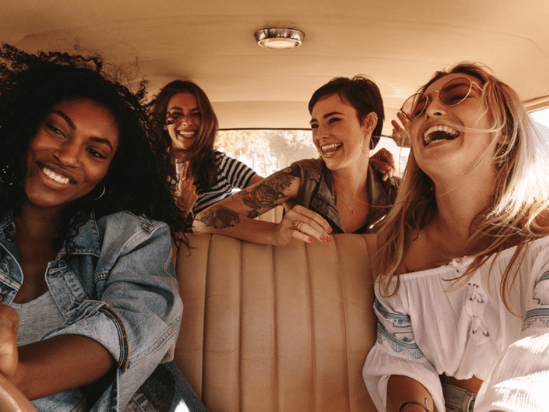 Group of four women on a road trip