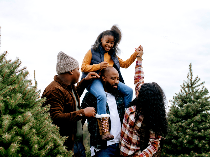 Group of people picking out a Christmas tree