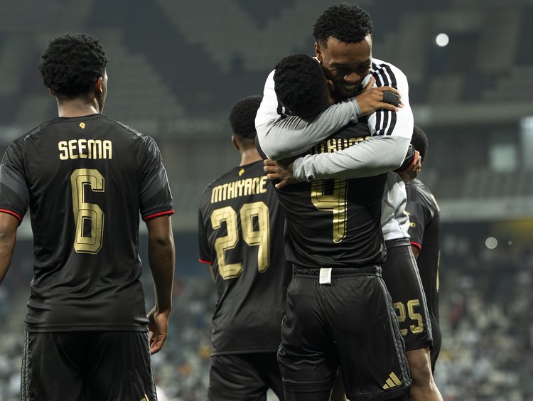 Orlando Pirates players hugging