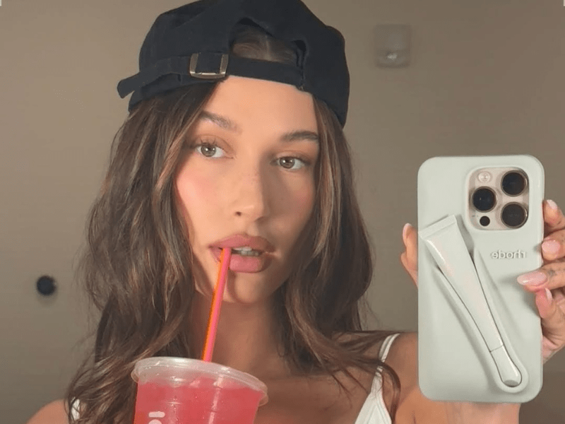 Hailey Bieber wearing a cap backwards