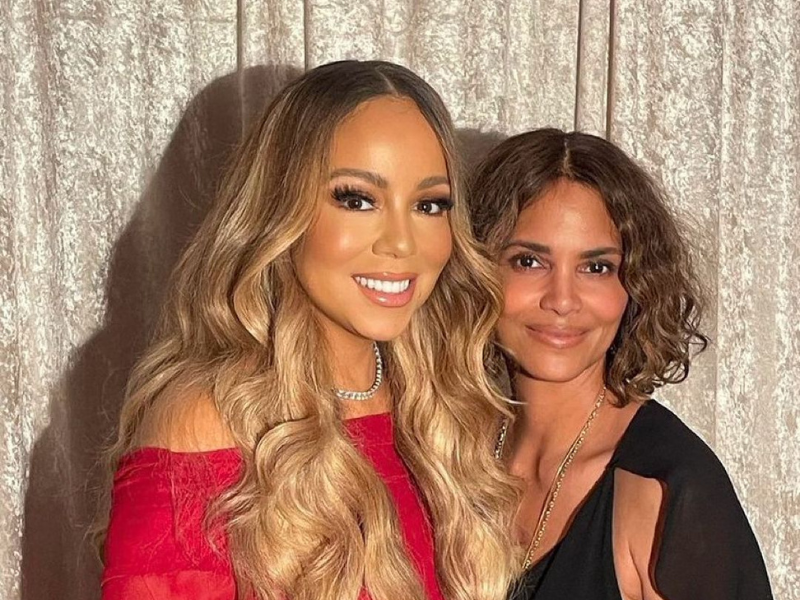 Halle Berry poses for a picture with Mariah Carey.png