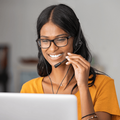 Happy Indian woman working at a call centre