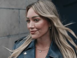Hilary Duff wearing a leather jacket