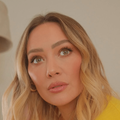 Singer Hilary Duff wearing a yellow top