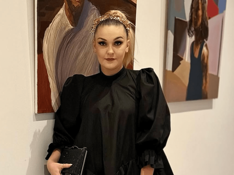 Holly Rey wearing a black dress