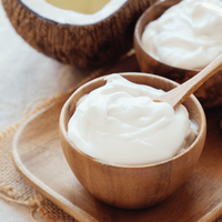 Homemade coconut greek yoghurt in wooden bowl
