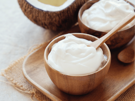 Homemade coconut greek yoghurt in wooden bowl