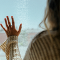 Homesick woman window