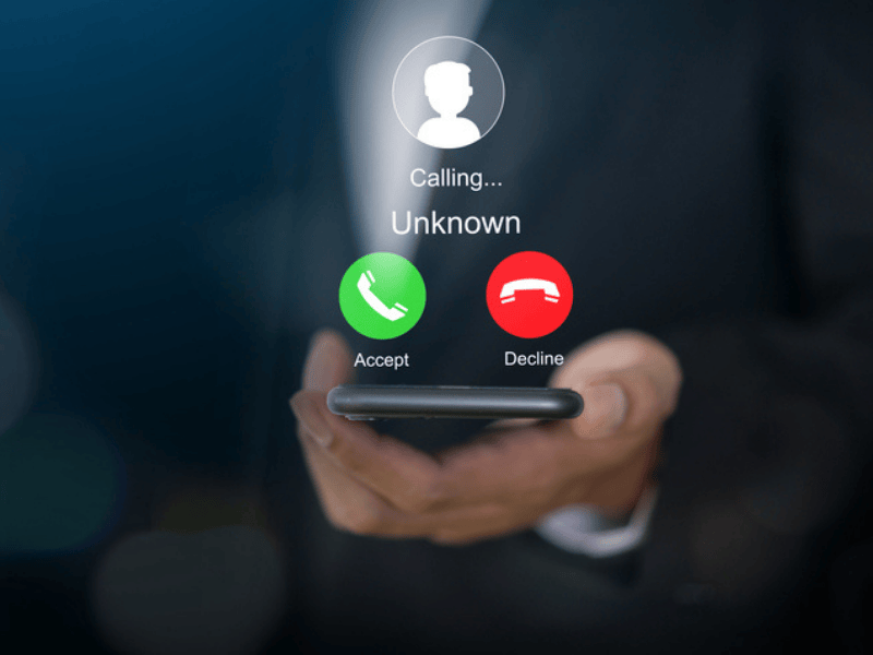 Human using a smartphone with incoming call from scammer