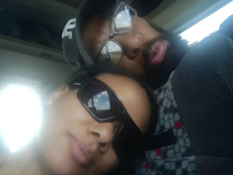 Husband and wife pose for a picture