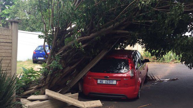 damaged car by storm