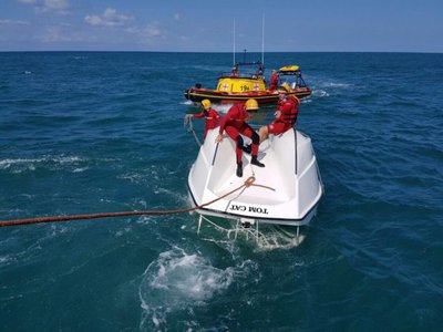 Son saves father's life after boat capsizes