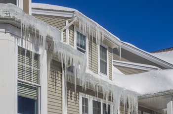Ice dams and snow on roof and gutters
