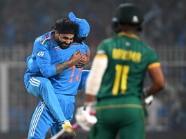 India's Ravindra Jadeja (L) celebrates with Virat Kohli after taking the wicket of  Proteas captain Temba Bavuma