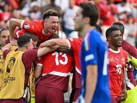Switzerland's midfielder Ruben Vargas (L), Switzerland's forward Kwadwo Duah (R) celebrate at the end of the UEFA Euro 2024 round of 16 football match between Switzerland and Italy.
