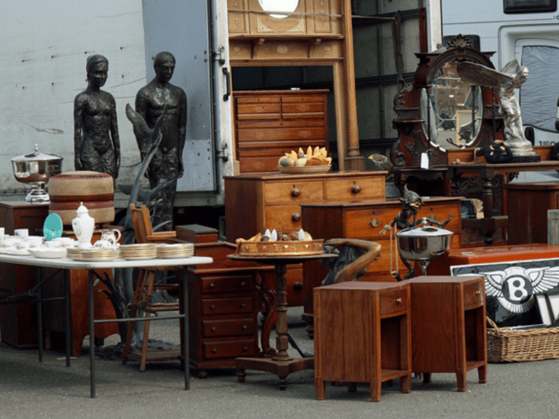 Items and furniture for sale at antique fair