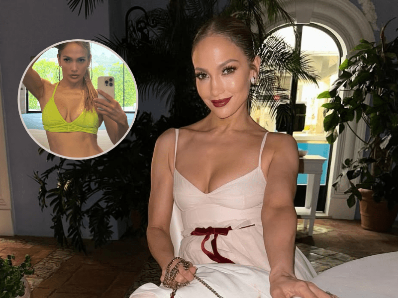 Jennifer Lopez sitting at restaurant table