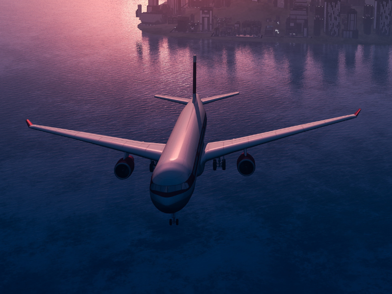 Jet flying over island during a beautiful sunset