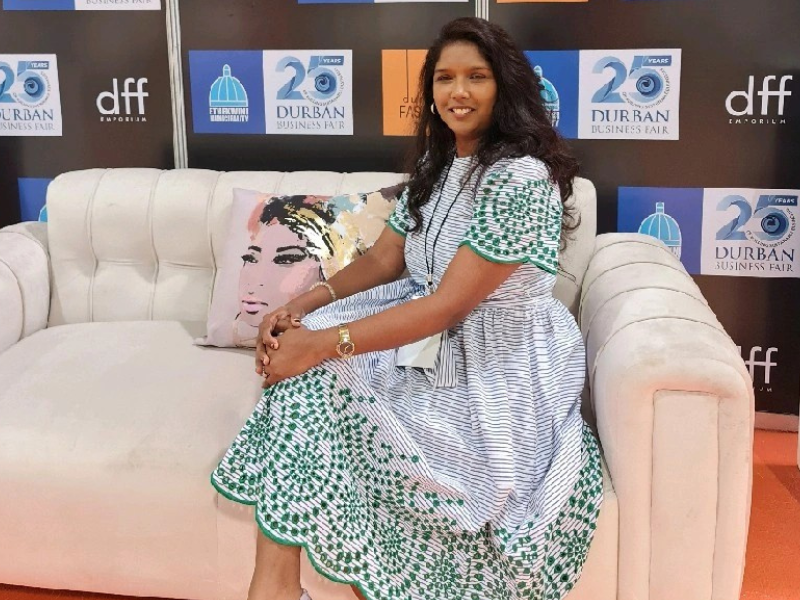 Joudelle Govender seated on a couch at the KZN Top Business Woman awards