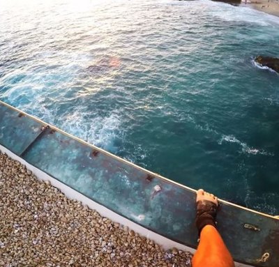 Daring guy jumps off building into pool