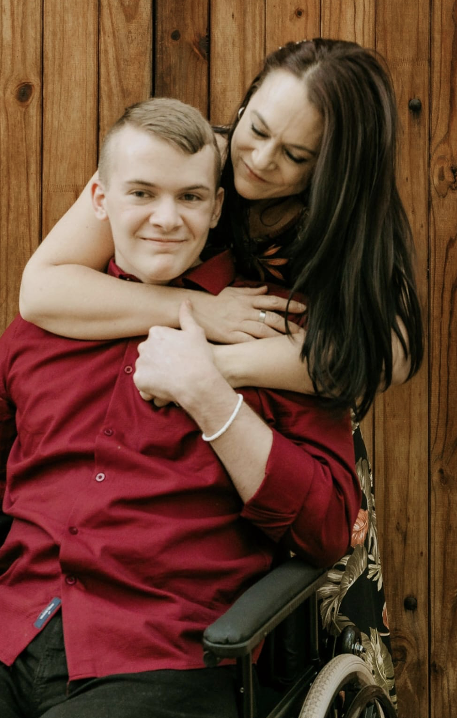 KEVIN JANSE VAN VUUREN IN WHEELCHAIR AND MOM