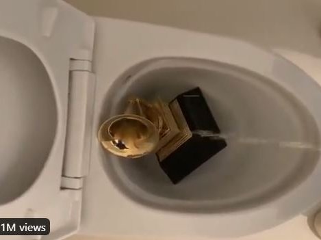 Kanye West peeing on his Grammy Award