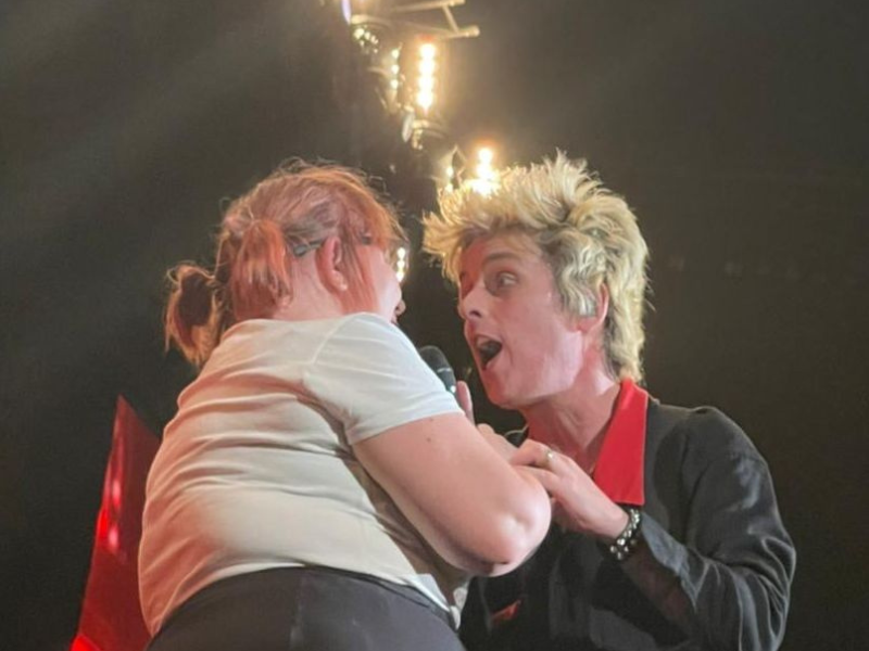 SA woman performs with Green Day Billie Joe on stage